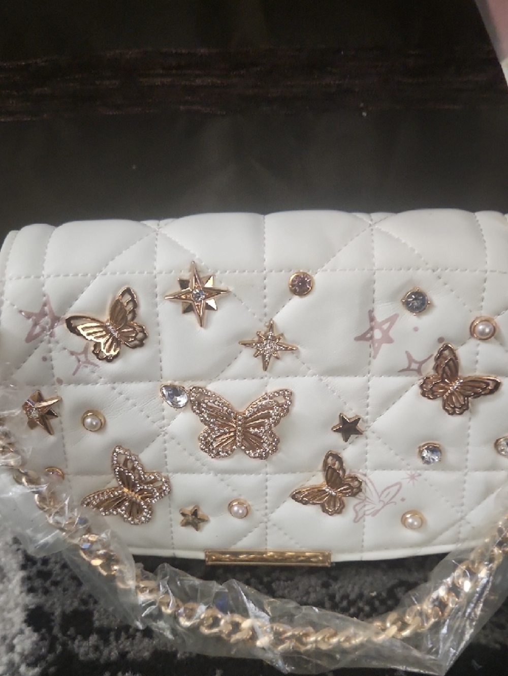 Small Aldo White Quilted Shoulder Bag with Gold Butterfly Accents - Picture 2 of 5